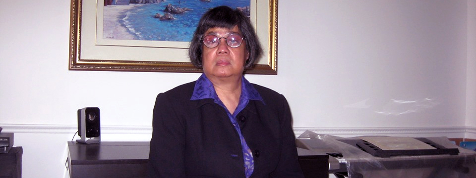 Donna Jodhan in a suit. Sitting. Facing the camera.