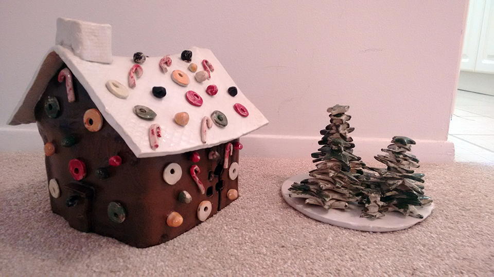 Donna's pottery creations of a gingerbread house and Christmas trees from October 2018.