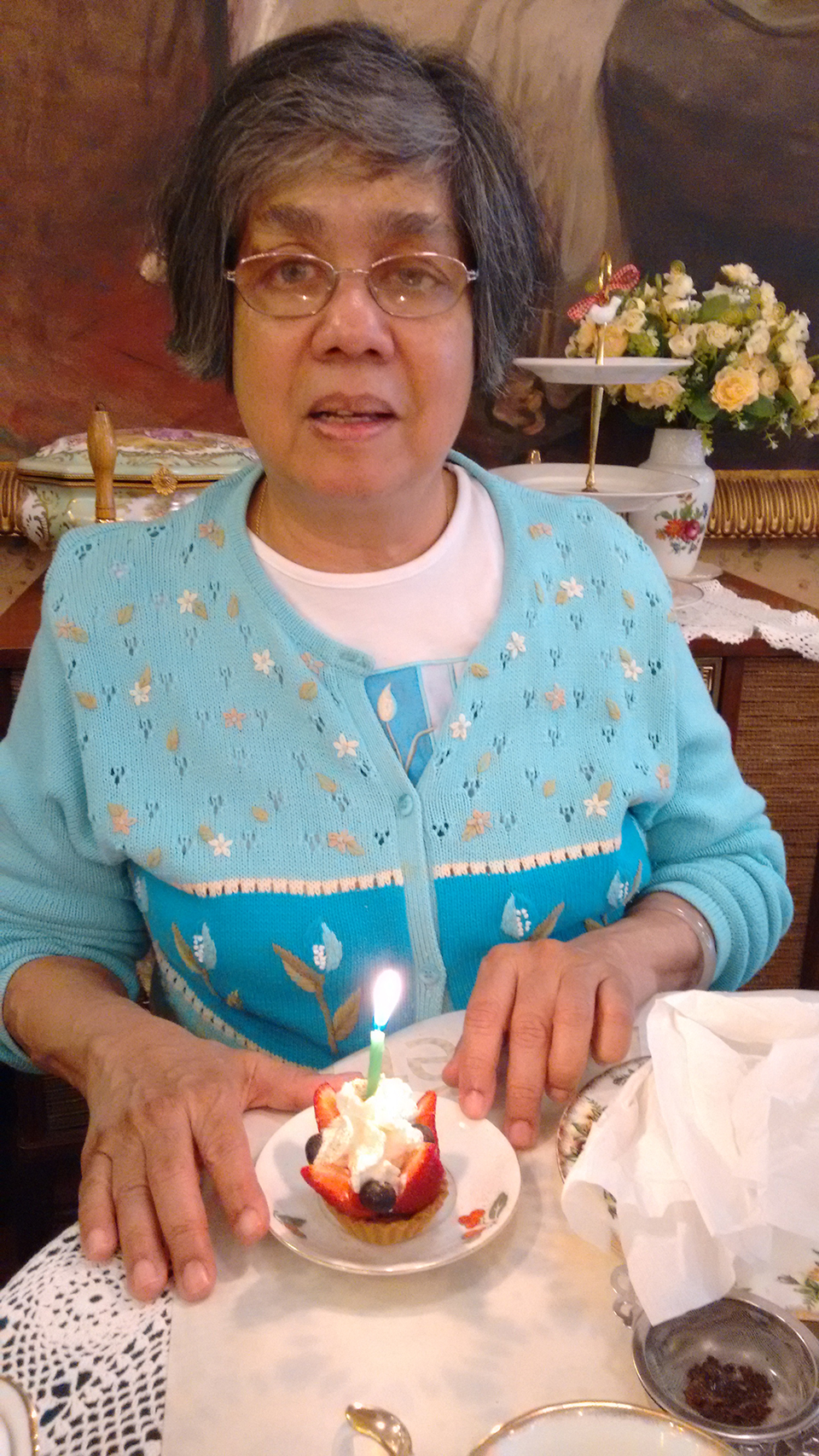 Donna blowing out a candle at her birthday tea. May 2019.