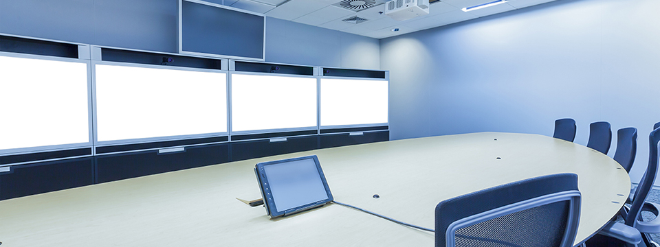 A large video conference and telepresence meeting room.