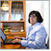 Image. Donna at laptop.