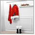 Crime Crusher Series Christmas Box Set #1: Episode #10: Santa's Secret Suit. A Santa Suit including pants, jacket, shirt, and belt hang on a white wall next to a sprig of mistletoe placed on a mantle. Two black boots with white fur sit on the floor.